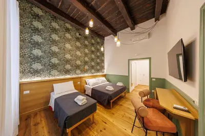 TV o dispositivi per l'intrattenimento presso The Tribunali Apartments By HouseinNaples