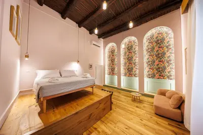 Letto o letti in una camera di The Tribunali Apartments By HouseinNaples
