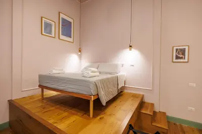 Letto o letti in una camera di The Tribunali Apartments By HouseinNaples