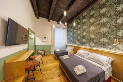 Letto o letti in una camera di The Tribunali Apartments By HouseinNaples