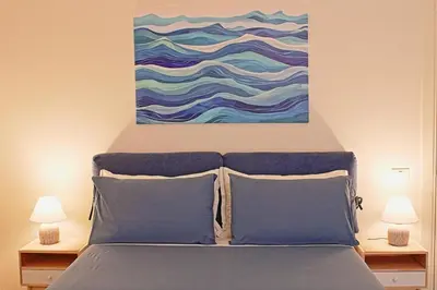 Letto o letti in una camera di Casa Salimbeni