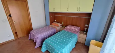 Letto o letti in una camera di Domus Baiano