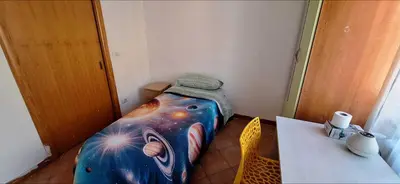 Letto o letti in una camera di Domus Baiano