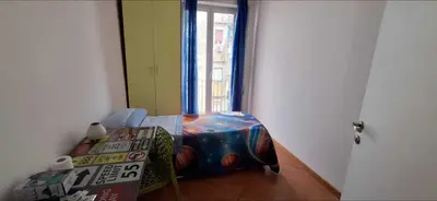 Letto o letti in una camera di Domus Baiano