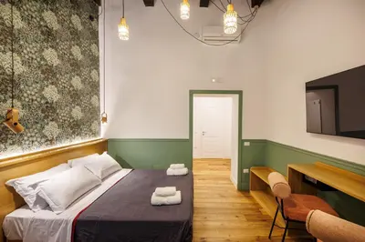 Letto o letti in una camera di The Tribunali Apartments - Entire Apt - By HouseinNaples