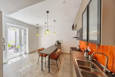 Cucina o angolo cottura di The Tribunali Apartments - Entire Apt - By HouseinNaples