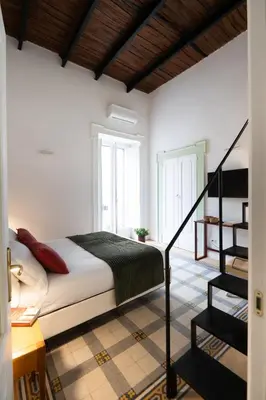 Letto o letti in una camera di Casa Crispi 51