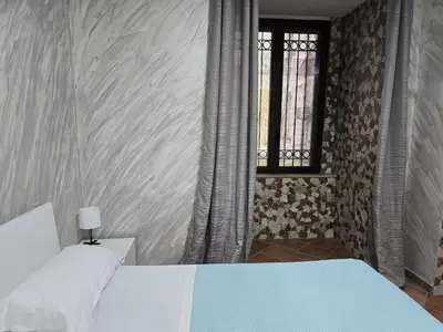 Letto o letti in una camera di Napoli Central Museo Suite near to Subway & Quartieri Spagnoli