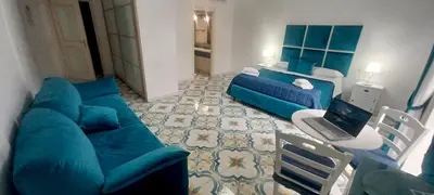 TV o dispositivi per l'intrattenimento presso Neapolis Rooms Santa Lucia