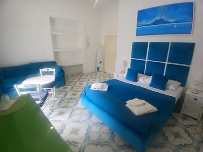 Letto o letti in una camera di Neapolis Rooms Santa Lucia