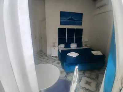 Area soggiorno di Neapolis Rooms Santa Lucia