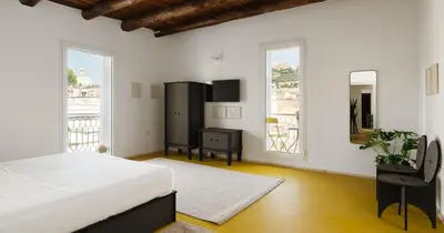 Letto o letti in una camera di Nuova Pizzofalcone