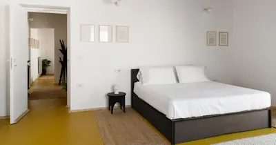 Letto o letti in una camera di Nuova Pizzofalcone