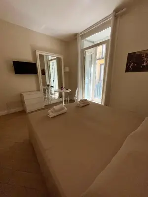 Letto o letti in una camera di de Ribera rooms in Naples