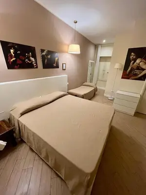 Letto o letti in una camera di de Ribera rooms in Naples