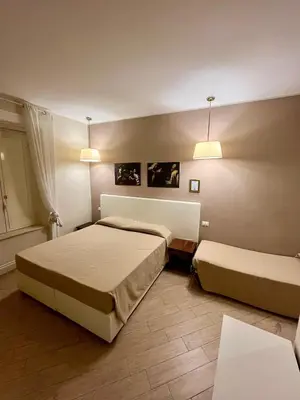 Letto o letti in una camera di de Ribera rooms in Naples