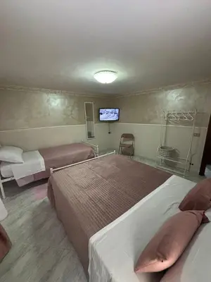 Letto o letti in una camera di Casa Concettina