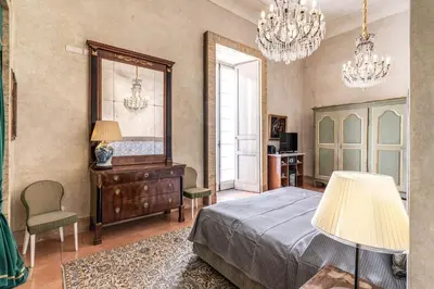 Letto o letti in una camera di Palazzo Doria Suites