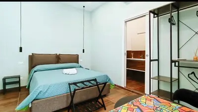 Letto o letti in una camera di Casa Calu' I Castelli di Napoli