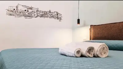 Letto o letti in una camera di Casa Calu' I Castelli di Napoli