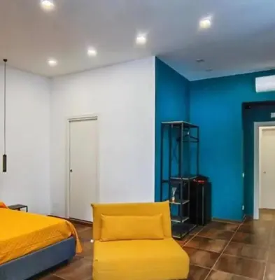 Letto o letti in una camera di Casa Calu' I Castelli di Napoli
