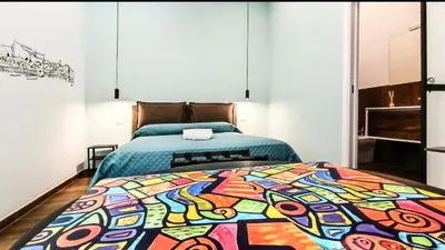 Letto o letti in una camera di Casa Calu' I Castelli di Napoli