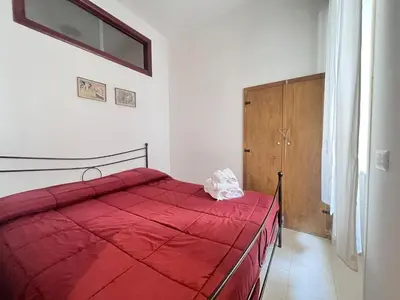 Letto o letti in una camera di Tribunali Cozy Apartment