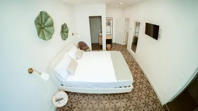 Letto o letti in una camera di Casa Le Arcate