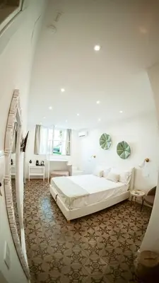 Letto o letti in una camera di Casa Le Arcate
