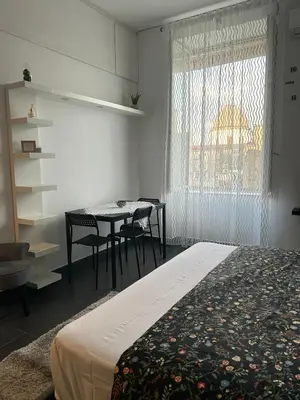 Letto o letti in una camera di TiTò Apartment