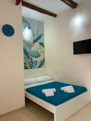 Letto o letti in una camera di TiTò Apartment