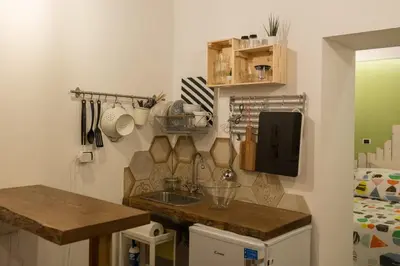 Cucina o angolo cottura di Casarià Holiday Home, Nel Cuore del Centro Storico di Napoli