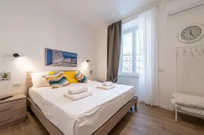 Letto o letti in una camera di Eleven11 Naples