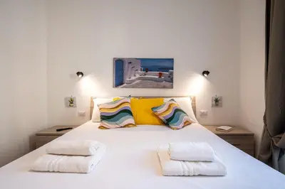 Letto o letti in una camera di Eleven11 Naples