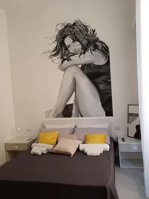 Letto o letti in una camera di OIVITA by LUGANI B&B COLLECTION