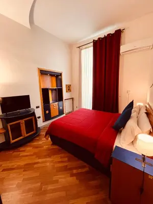 Letto o letti in una camera di Parthenope b&b