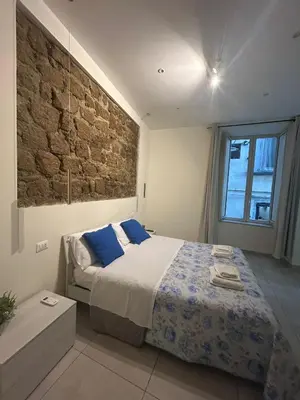 Letto o letti in una camera di Dimora Montecalvario