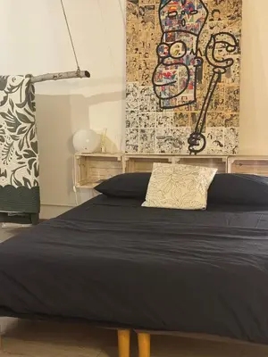 Letto o letti in una camera di Painthouse creative house in Piazza Plebiscito