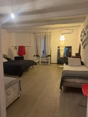 Letto o letti in una camera di Painthouse creative house in Piazza Plebiscito