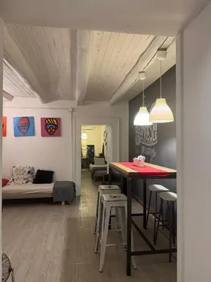 Area soggiorno di Painthouse creative house in Piazza Plebiscito