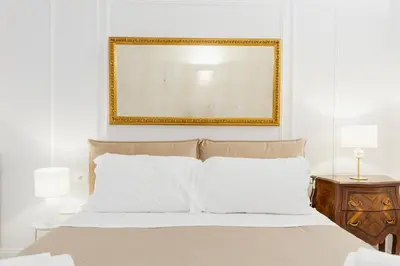 Letto o letti in una camera di Atri Rooms Centro Storico Napoli