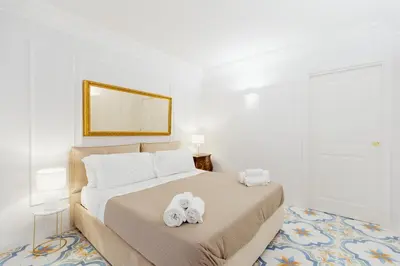 Letto o letti in una camera di Atri Rooms Centro Storico Napoli