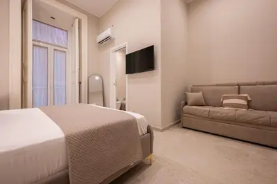 Letto o letti in una camera di Madame Toledo Luxury Rooms
