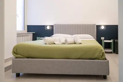 Letto o letti in una camera di Dimora Merliani