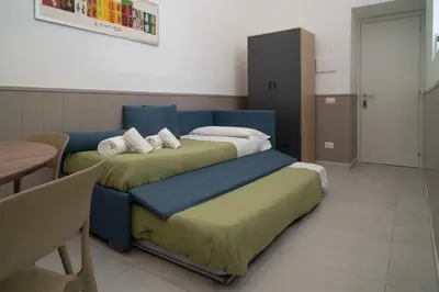 Letto o letti in una camera di Dimora Merliani