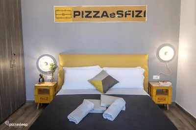 Letto o letti in una camera di pizzasleep Station