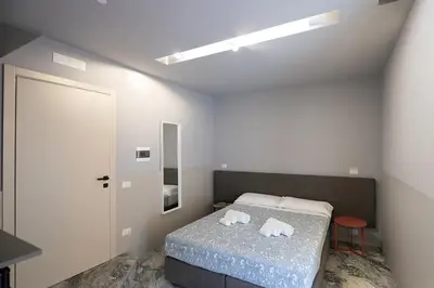 Letto o letti in una camera di Mia Suites Angioino