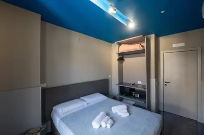 Letto o letti in una camera di Mia Suites Angioino