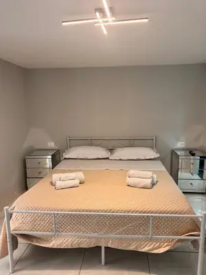 Letto o letti in una camera di Nel cuore di Napoli