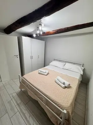 Letto o letti in una camera di Nel cuore di Napoli
